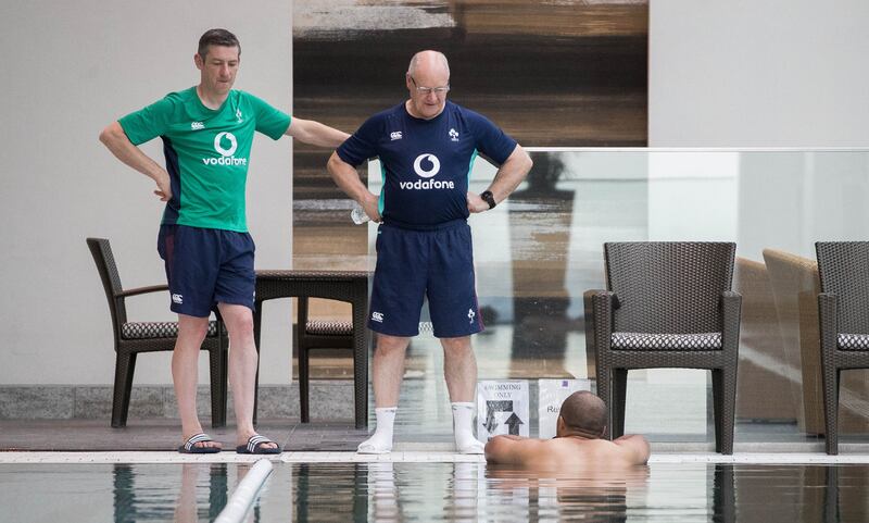 Physio Keith Fox and masseur Willie Bennett with Simon Zebo at an Ireland rugby squad pool recovery session at the Conrad Tokyo in 2017. Photograph: Ryan Byrne/Inpho