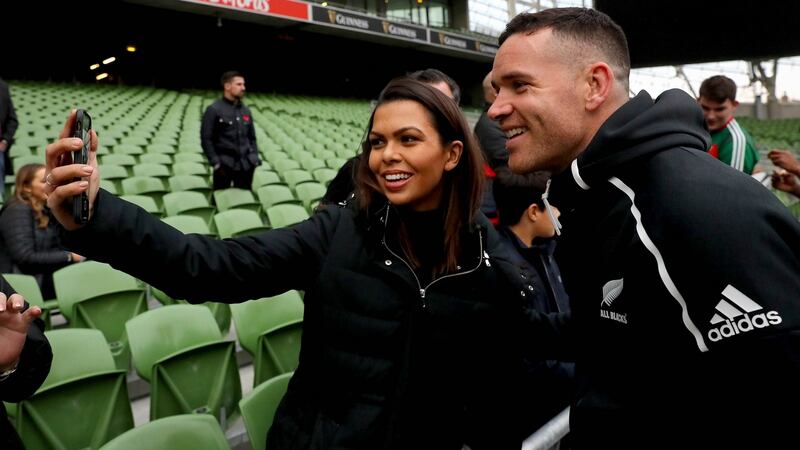 Ryan Crotty takes pictures with fans during the captain’s run. Photograph: Ryan Byrne/Inpho