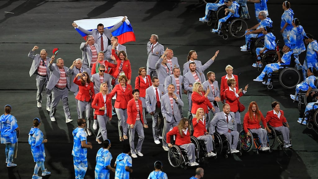 Andrei Fomochkin waves a Russian flag as the Belarus team enter the Maracana for the opening ceremony of the 2016 Rio Paralympic Games. Photograph: Adam Davy/PA