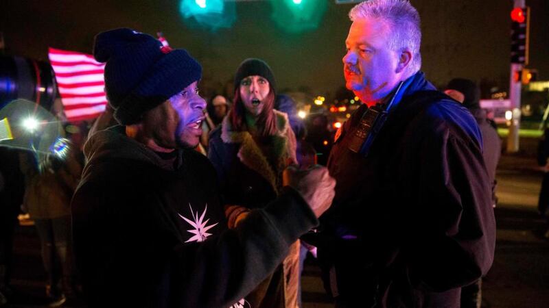 Protesters confront police at an intersection after a man was fatally shot by a policeman in Berkeley, Missouri, December 24, 2014. Photograph: Aaron P Bernstein/Reuters