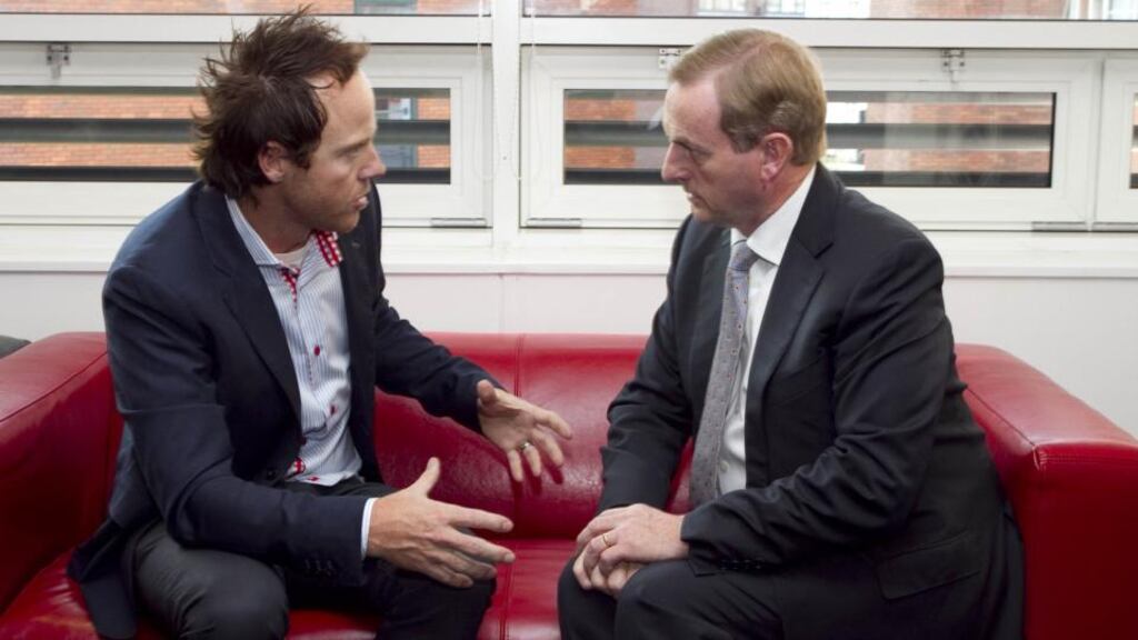 Qualtrics chief executive Ryan Smith with Taoiseach Enda Kenny: the tech firm has leased a building close to St Stephen’s Green and it has more space than it needs to accommodate the planned 250-strong workforce. Photograph: Colm Mahady/Fennells