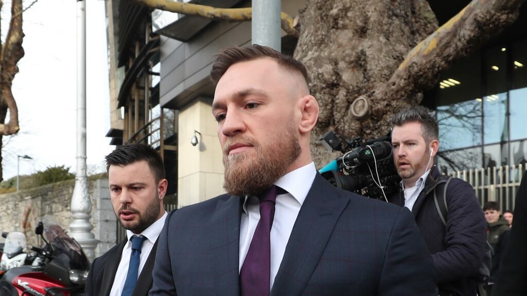 Conor McGregor leaves Dublin District Court after appearing in relation to motoring offences. Photograph: Niall Carson/PA Wire