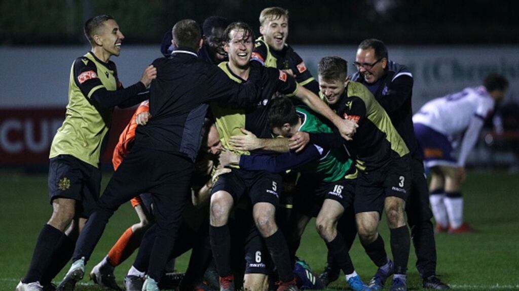 Marine players celebrate after winning their FA Cup second round. Photograph: Getty Images