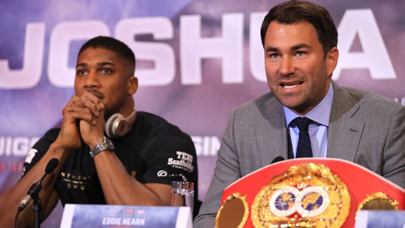 Promoter Eddie Hearn with Joshua during the pre-fight press conference. Photo: Richard Heathcote/Getty Images
