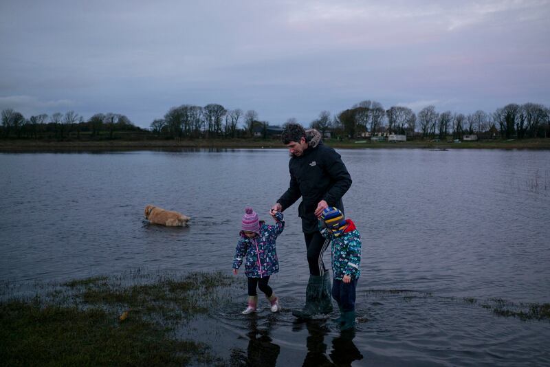 Andrew Keane, a seventh son who was told he had the cure for ringworm, with his children in Cloghans, Co Mayo