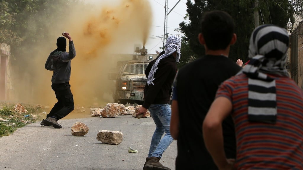 Israeli security forces spray foul-smelling Skunk towards Palestinian stone throwers. Photograph: Jaafar Ashtiyeh/AFP/Getty Images