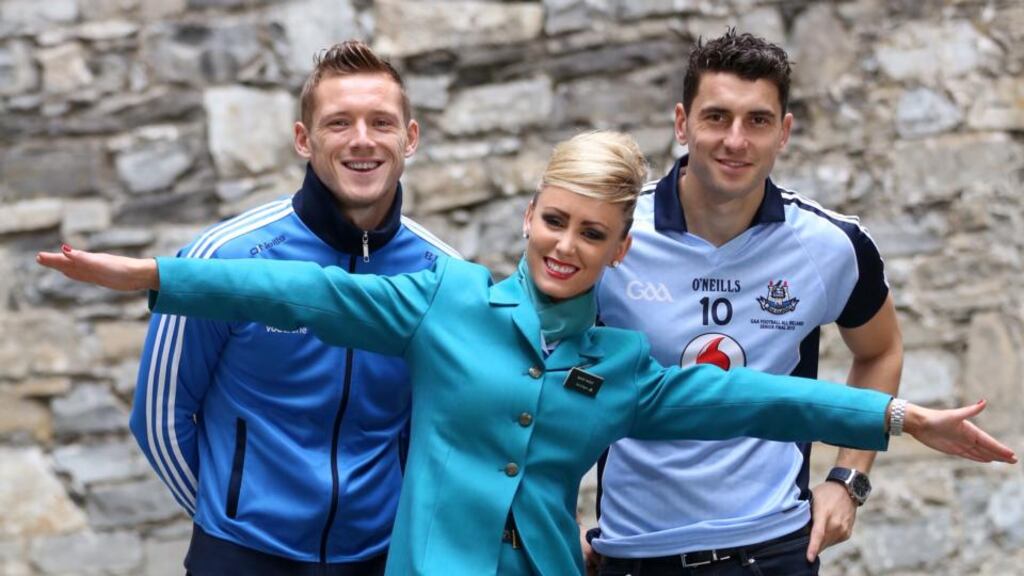 Dublin stars Paul Flynn and Bernard Brogan with Aer Lingus cabin crew member Mary Wade yesterday launching the Aer Lingus Big Take Off Sale. As part of the sale, Aer Lingus are taking up to half price off all fares with over 3 million seats to over 70 destinations. Photo: Jason Clarke