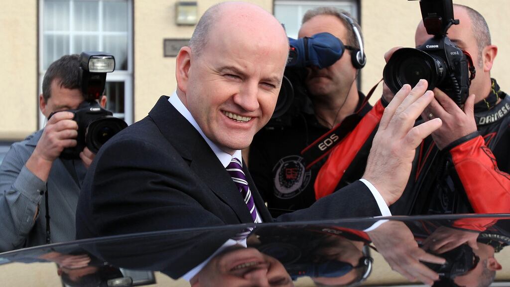 Businessman Sean Gallagher waves to photographers after voting in the 2011 presidential election.