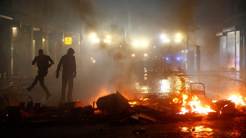 Protesters gather near a burning barricade during demonstrations at the G20 summit in Hamburg. Photograph: REUTERS/Hannibal Hanschke