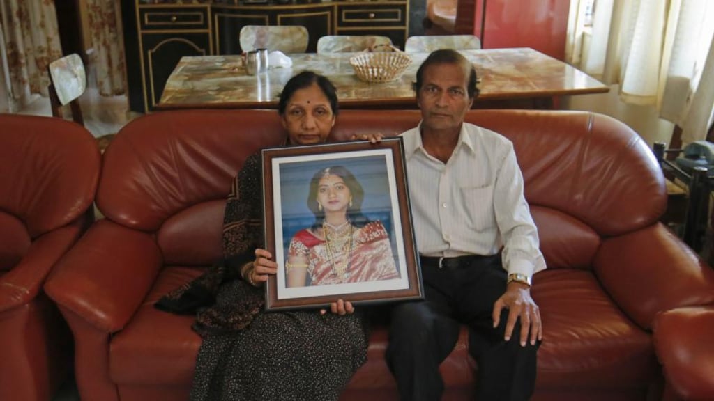 Mahadevi and Andanappa Yalagi, parents of Savita Halappanavar, hold her portrait as their house in Belgaum in the southern Indian state of Karnataka. Photograph: Danish Siddiqui/Reuters