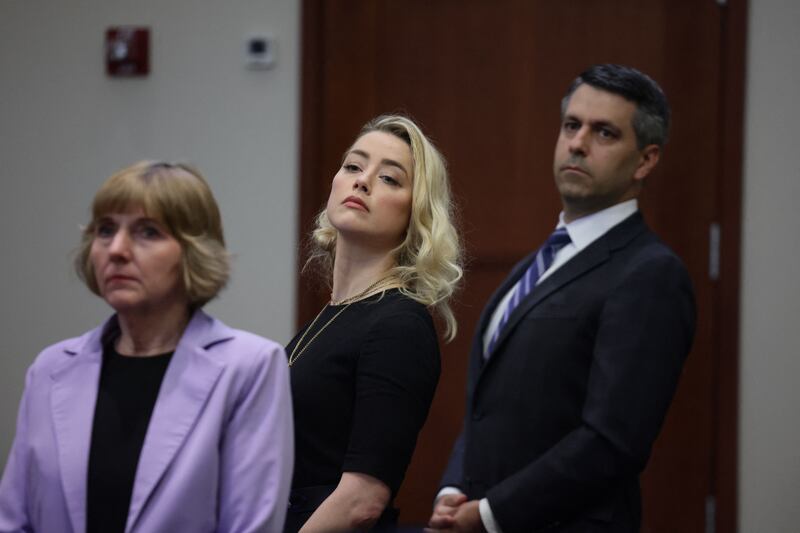 Amber Heard and her attorneys look over to the jury. Photograph: Evelyn Hockstein/Pool/AFP via Getty
