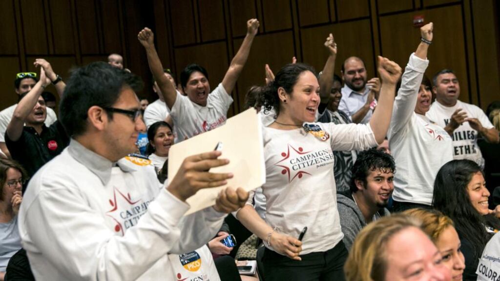 Supporters of immigration reform cheer after the Senate Judiciary Committee approved legislation to overhaul the nation’s immigration laws, on Capitol Hill. Photograph: Drew Angerer/The New York Times