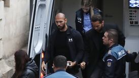 Andrew Tate to remain in custody pending human trafficking investigation