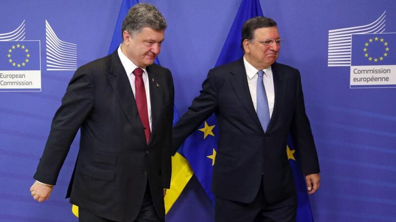 President of Ukraine Petro Poroshenko (L) is welcomed by EU Commission president Jose Manuel Barroso (R) prior to a meeting at the EU Commission headquarters in Brussels today. Photograph: EPA