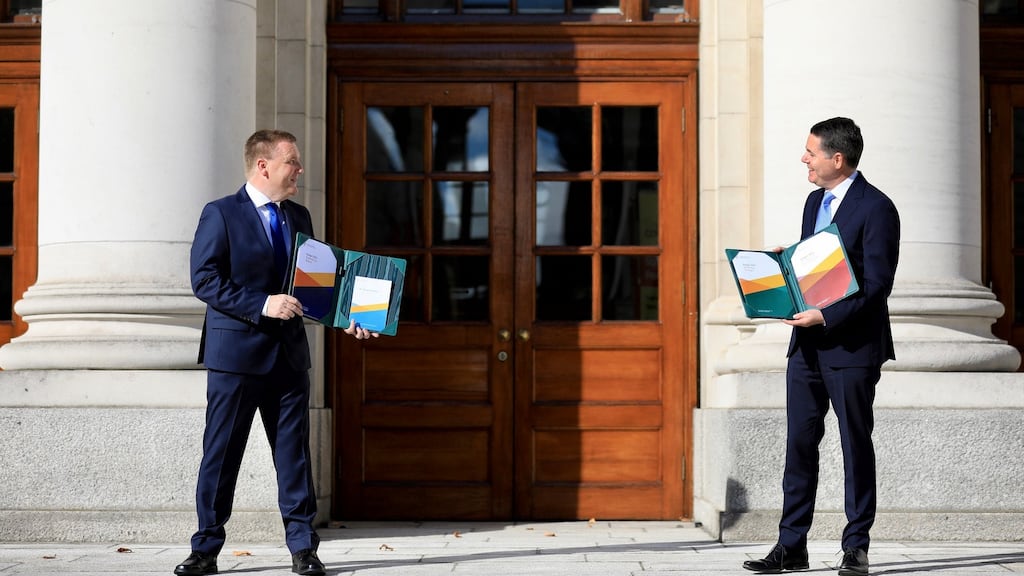 Minister for Finance Paschal Donohoe (right) and Minister for Public Expenditure Michael McGrath outside Government Buildings in Dublin before outlining details of Budget 2021. Photograph: Julien Behal Photography/PA Wire
