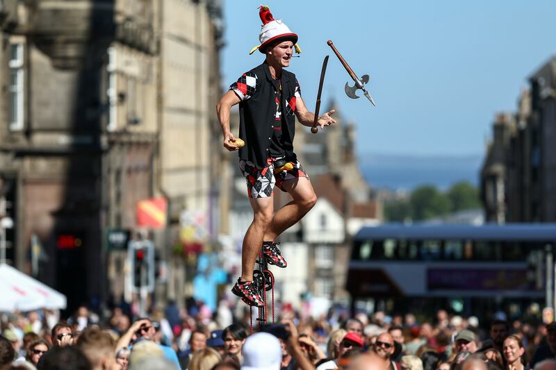 A juggler on Edinburgh's Royal Mile during the city's Festival Fringe in 2024. Photograph: Jeff J Mitchell/Getty Images