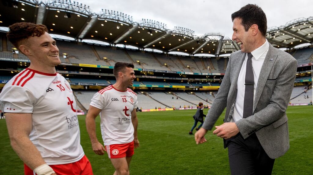 Tyrone’s Conor Meyler and Darren McCurry celebrate with RTÉ pundit Seán Cavanagh. Photo: James Crombie/Inpho