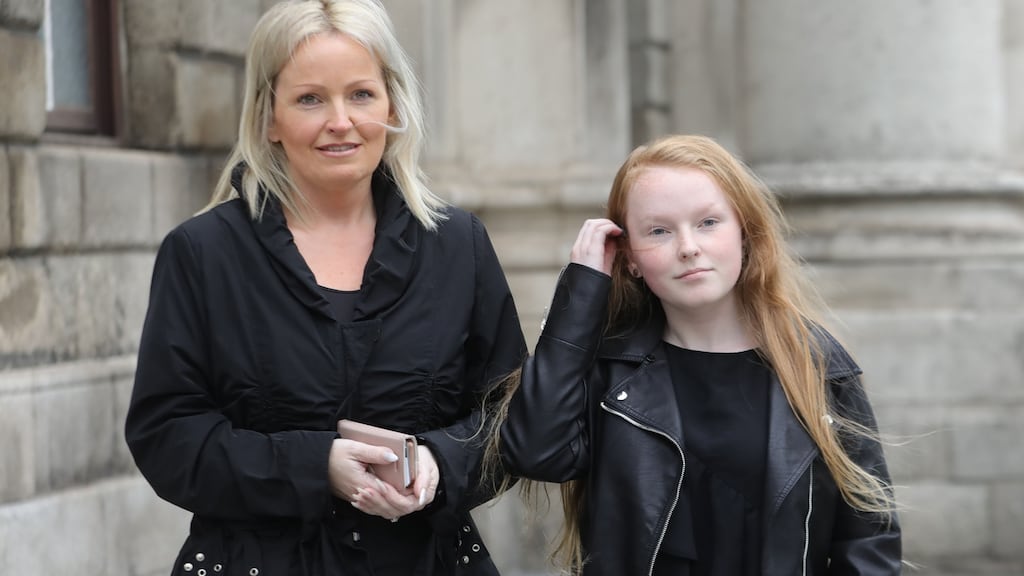 Shannon Whelan Loy (14), right, with her mum, Catherine Whelan of St Lawrence Terrace, Howth, Co. Dublin pictured leaving the Four Courts on Wednesday after a High Court action for damages. Photograph: Collins Courts