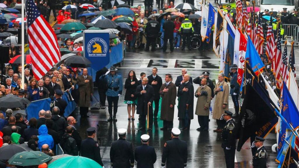 Dignitaries including US vice-president Joe Biden, survivors and first responders participate in a flag-raising ceremony at the marathon finishing line in Boston, Massachusetts, yesterday, on the first anniversary of the Boston Marathon bombings. Photograph: Reuters/Brian Snyder