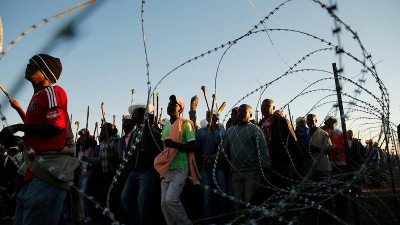 Miners on strike chant slogans as they march in Nkaneng township outside the Lonmin mine in Rustenburg. Photograph: Siphiwe Sibeko/Reuters