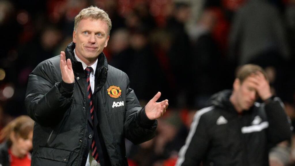 Manchester United manager David Moyes smiles as he leaves the pitch after his team’s 2-0 win against Swansea City on Saturday. Photograph: Martin Rickett/PA Wire.