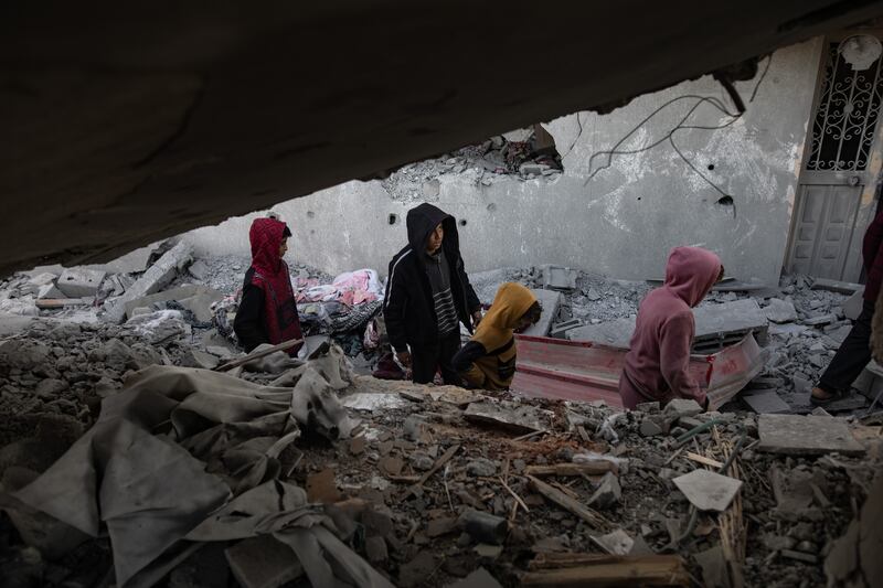 Palestinians inspect the site of an Israeli air strike in the Khan Yunis camp in southern Gaza. Photograph: Haitham Imad/Shutterstock/EPA-EFE