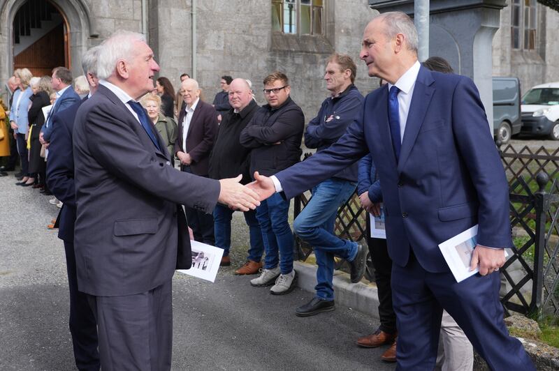 Taoiseach Micheál Martin shakes hands with former taoiseach Bertie Ahern at the funeral mass for Martin Mansergh. Photograph: Niall Carson/PA Wire