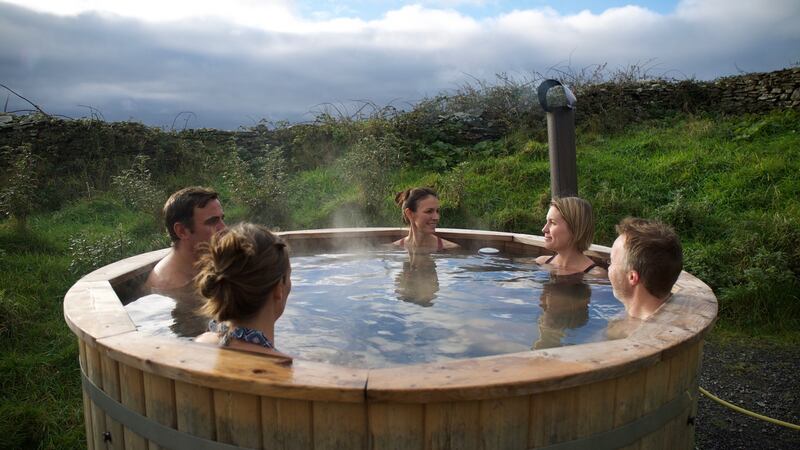 ‘In the evening it’s cold and windy outside, and the stove in the cosy cottage is calling me, but so is the hot tub I spotted outside the studio.’