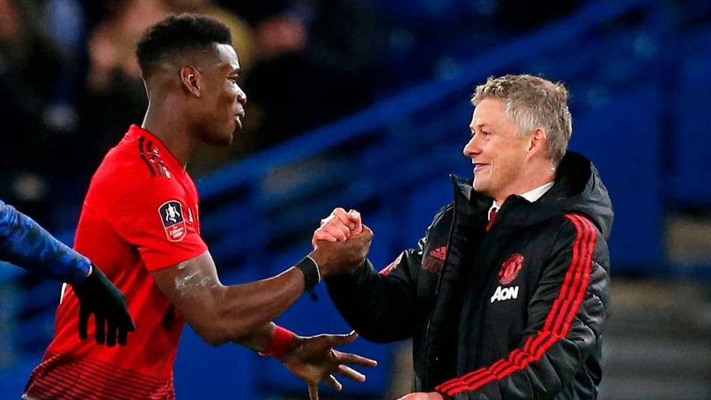 Paul Poga and Ole Gunnar Solskjaer celebrate after Manchester United’s win over Chelsea in the FA Cup. Photograph: Ian Kington/AFP/Getty