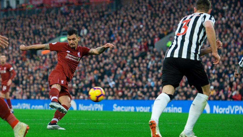Liverpool’s Dejan Lovren scores against Newcastle United at Anfield. Photograph: EPA