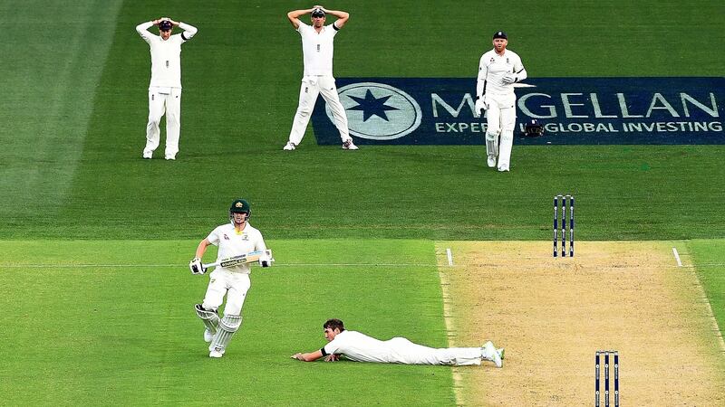 Steve Smith runs past Craig Overton. Photo: Dave Hunt/EPA
