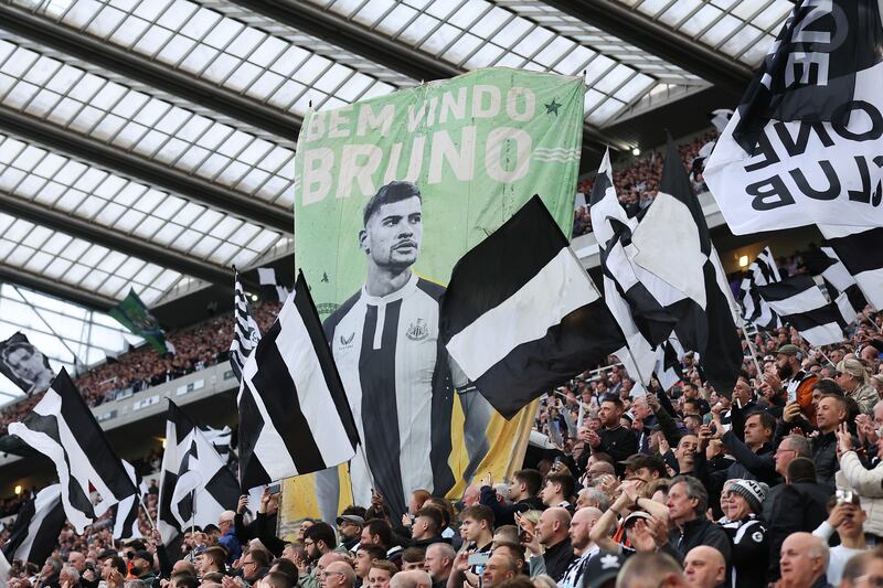 Newcastle United fans hold up a banner displaying their player Bruno Guimarães prior to the Premier League match against Leicester City at St James's Park on May 22nd. Photograph: Getty Images