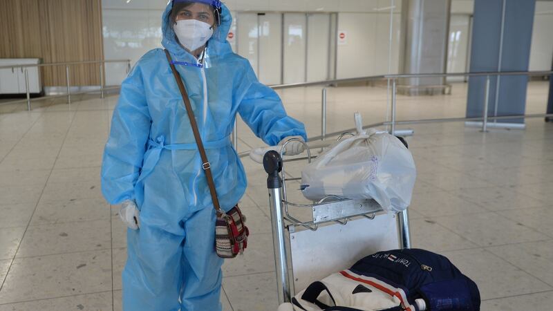 Pharmacist Krishna Priya Kodumadu Venkittaraman from Tamilnadu one of over 50 health care professionals who arrived in to Dublin Airport on a flight from India. Photograph: Alan Betson