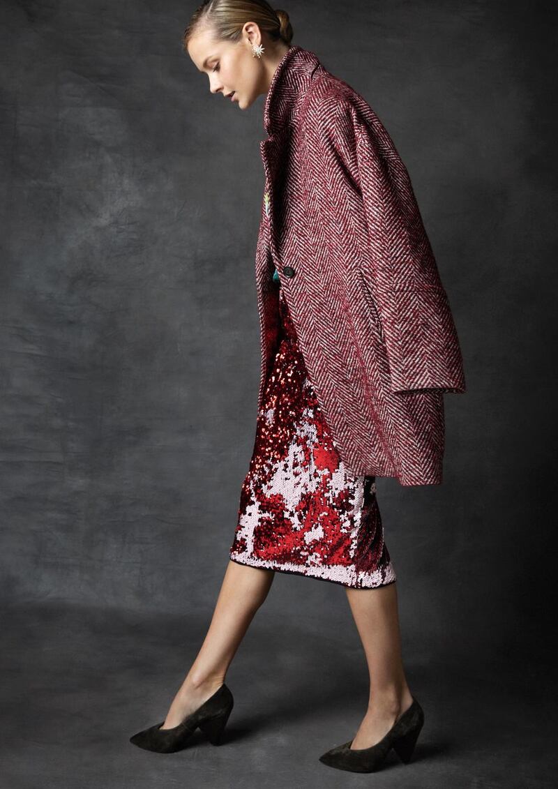 Red herringbone tweed coat Gant €365, floral top Essentiel Antwerp €159, sequinned skirt Essentiel Antwerp €129, Nova stud star earrings, Lulu Frost at Loulerie €199, olive suede pump shoe, Ash €190