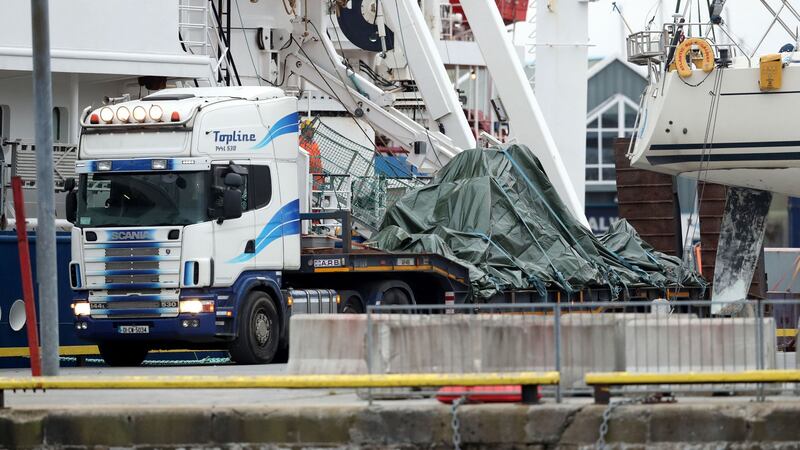 The wreckage of the Irish Coast Guard helicopter leaves Galway harbour on a flat bed truck. Photograph: Brian Lawless/PA Wire
