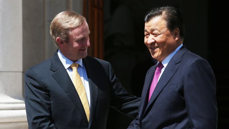 Taoiseach, Enda Kenny, greets Mr Liu Yunshan, at Government Buildings, Dublin. Photograph: Brian Lawless/PA