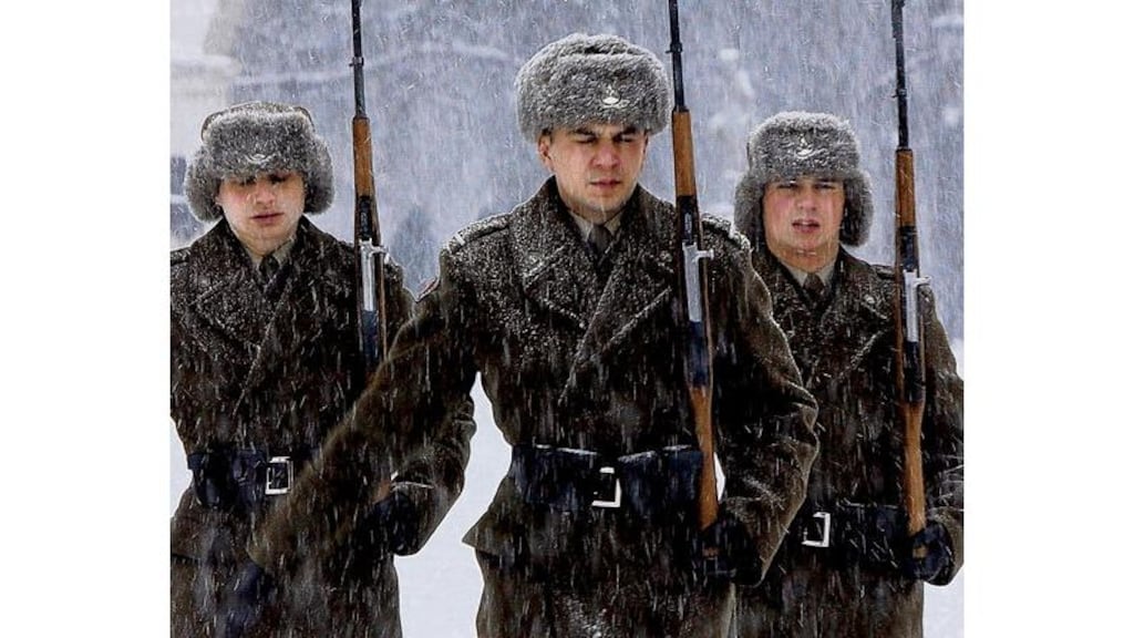 Soldiers return to duty at the tomb of the unknown soldier in Warsaw on Wednesday; 122 people have died from the cold in Poland where the temperature has fallen as low as minus 15 degrees. Photograph: Czarek Sokolowski/AP Photo