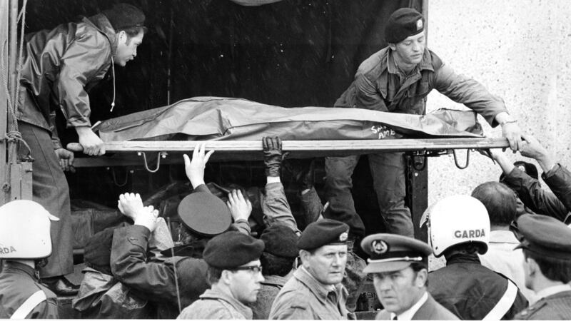 A victim of the Air India disaster is lifted onto an army truck at Cork Airport in 1985. Photograph: Jack McManus