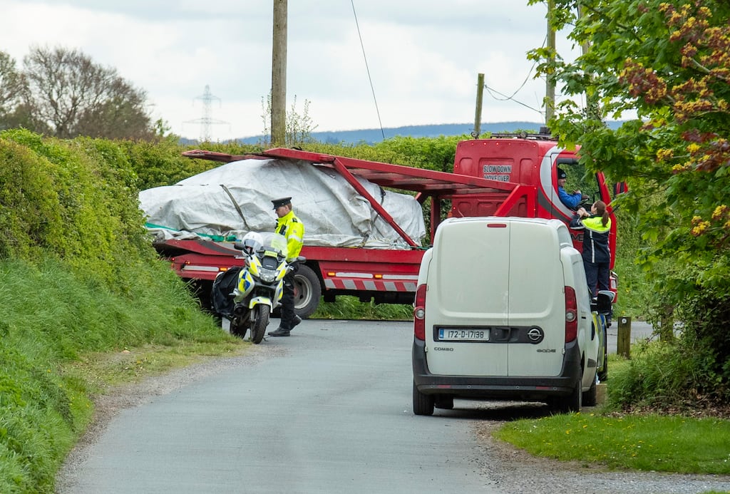 A burnt-out car is removed from the scene of an incident near Ballon in Co Carlow where a motor cyclist died in what appeared to be a hit-and-run.
Photograph: Finbarr O'Rourke