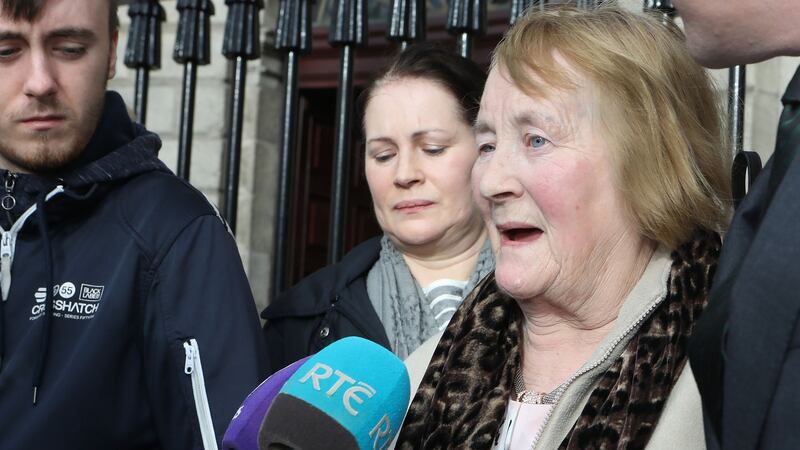 Esther Lonergan speaks to reporters after her family settled cases against two hospitals following the deaths of her husband and son. Photograph: Collins