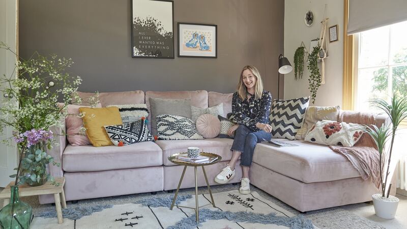 Ciara Elliott and her new DFS couch. Photograph: Jemma Watts