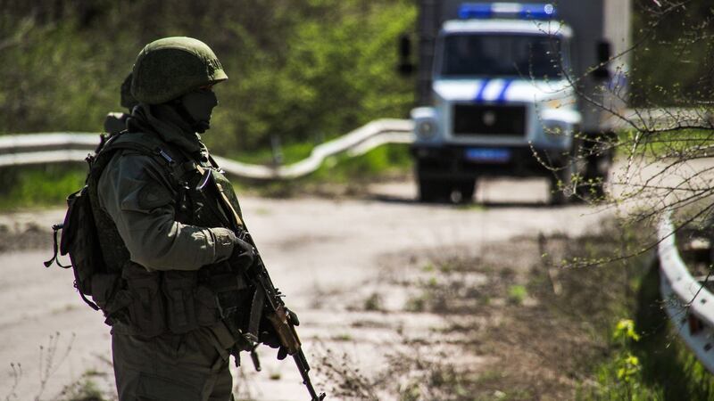 A serviceman of the Lugansk People’s Republic in eastern Ukraine in April prepares to hand over prisoners to Kiev on the contact line near the town of Schastia. Photograph: Alexander Rekaass