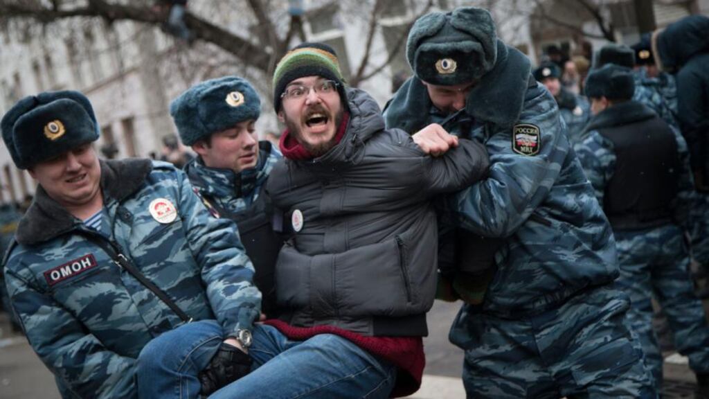 Police detain a man outside Zamoskvoretsky district court in Moscow yesterday. Photograph: AP Photo/Alexander Zemlianichenko