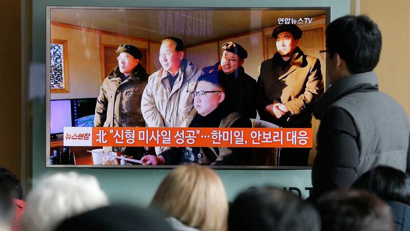 People in Seoul, South Korea watch a TV news programme showing North Korean leader Kim Jong Un. Photograph: Ahn Young-joon/AP
