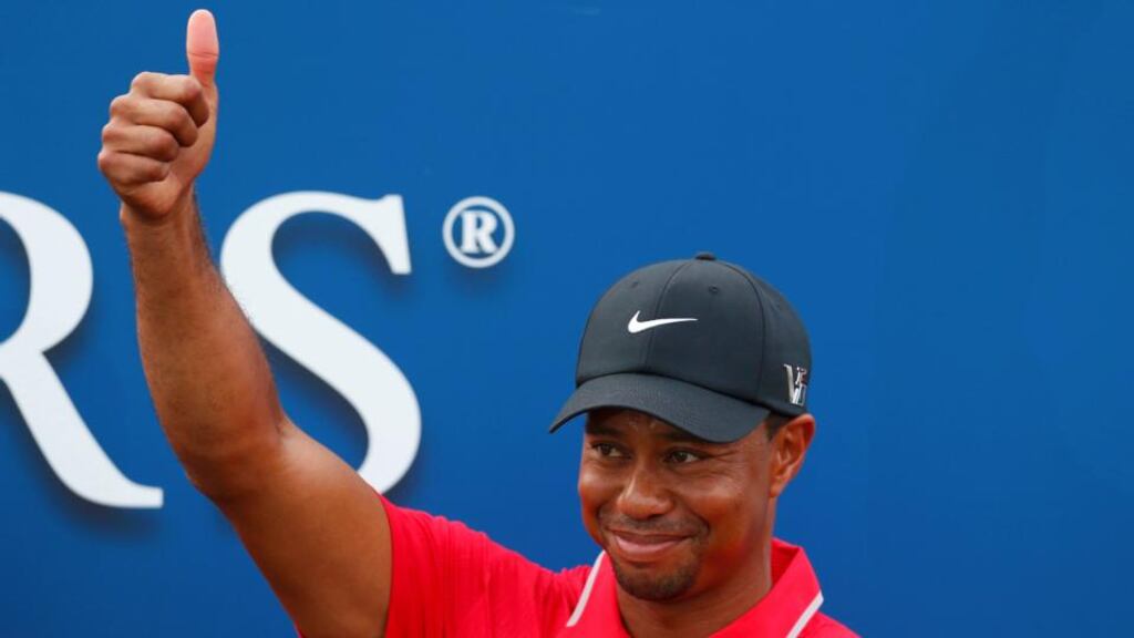Tiger Woods after being presented with the Players Championship trophy at Sawgrass in Florida last night. Photograph: Chris Keane/Reuters