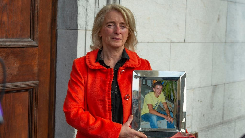 Mary Tyner, mother of jockey Jack Tyner, who died in CUH in 2011, holds his photo outside Cork court. Photograph: Michael Mac Sweeney/ Provision