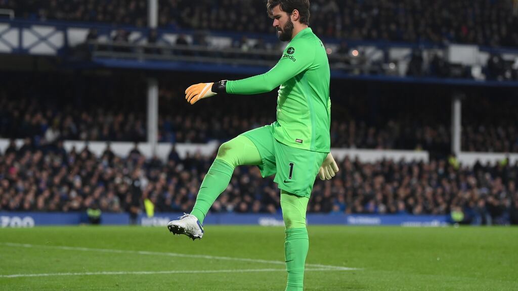 Liverpool goalkeeper Alisson Becker kicks a bottle off of the pitch during the Premier League match against Everton at Goodison Park in December. Photograph: Laurence Griffiths/Getty Images