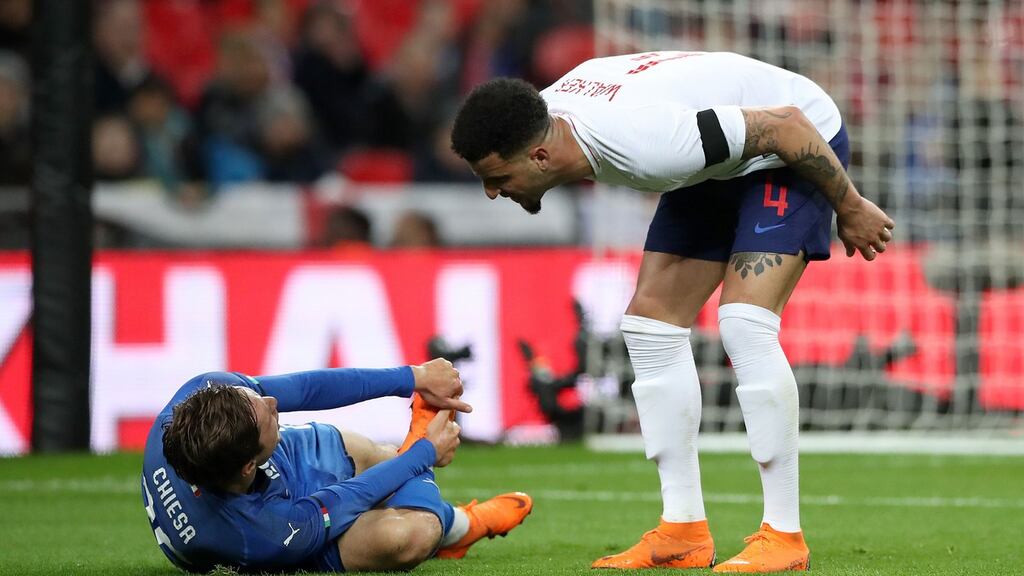 England’s Kyle Walker speaks with Italy’s Federico Chiesa after he is fouled resulting in a penalty at Wembley Stadium. Photograph: PA