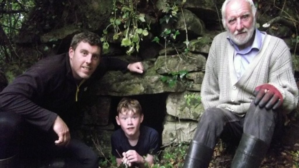 Farmer Michael McPartland (right) with his son Rory and his grandson Paddy (12) at a sweathouse on their family farm at Cornageeha, Co Leitrim. Photograph: Donald McCarthy
