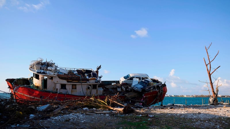 A ship that was pushed up near the road from a storm surge is seen in Marsh Harbour, Bahamas during Hurricane Dorian. Photograph: Andrew Caballero/AFP/Getty